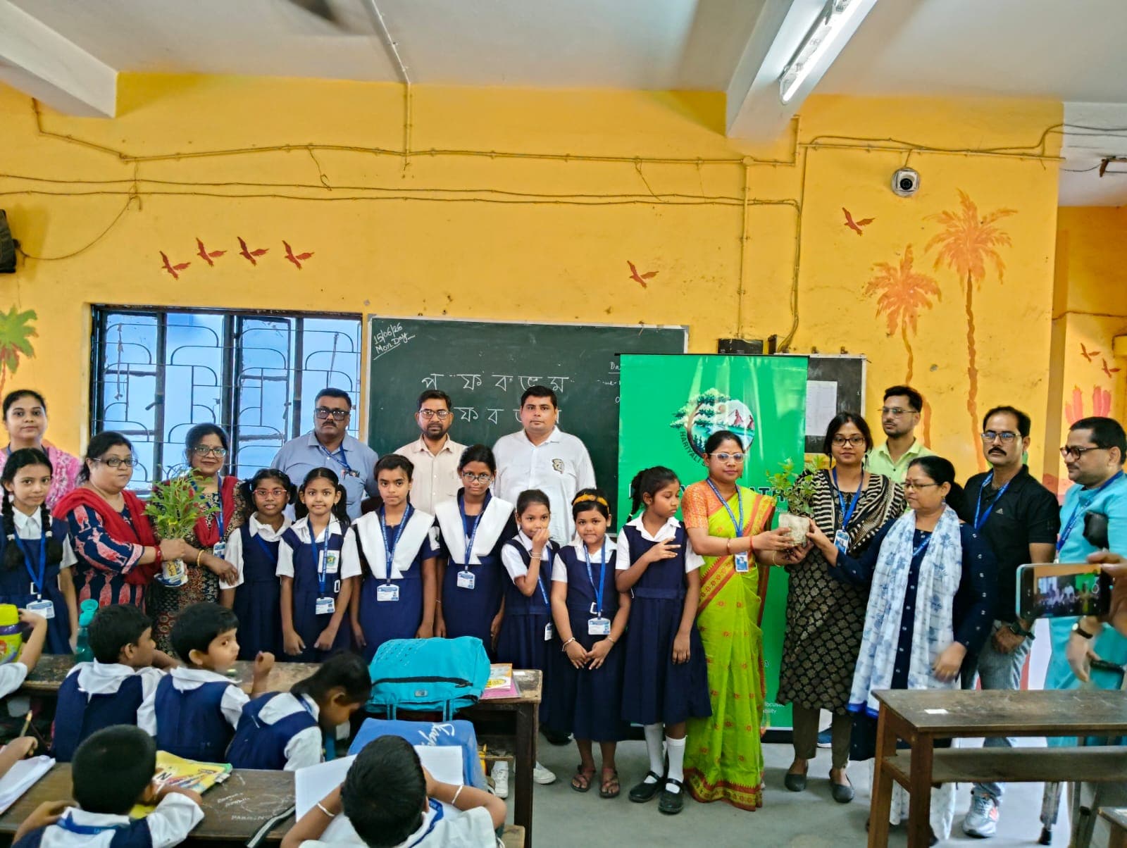 Happy participants gathered for a Hariyali Sathi tree plantation event.